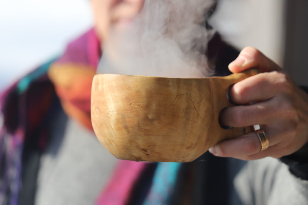 A wooden cup with steam