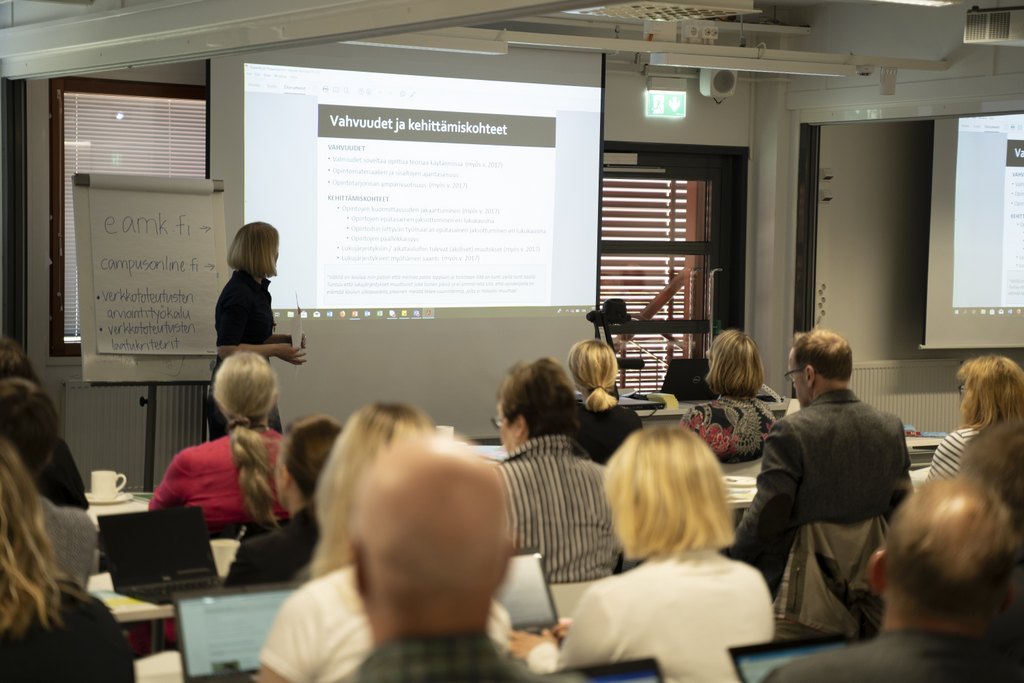 People listening to a class.