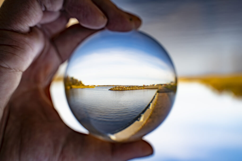 Lensball with sea and pier.
